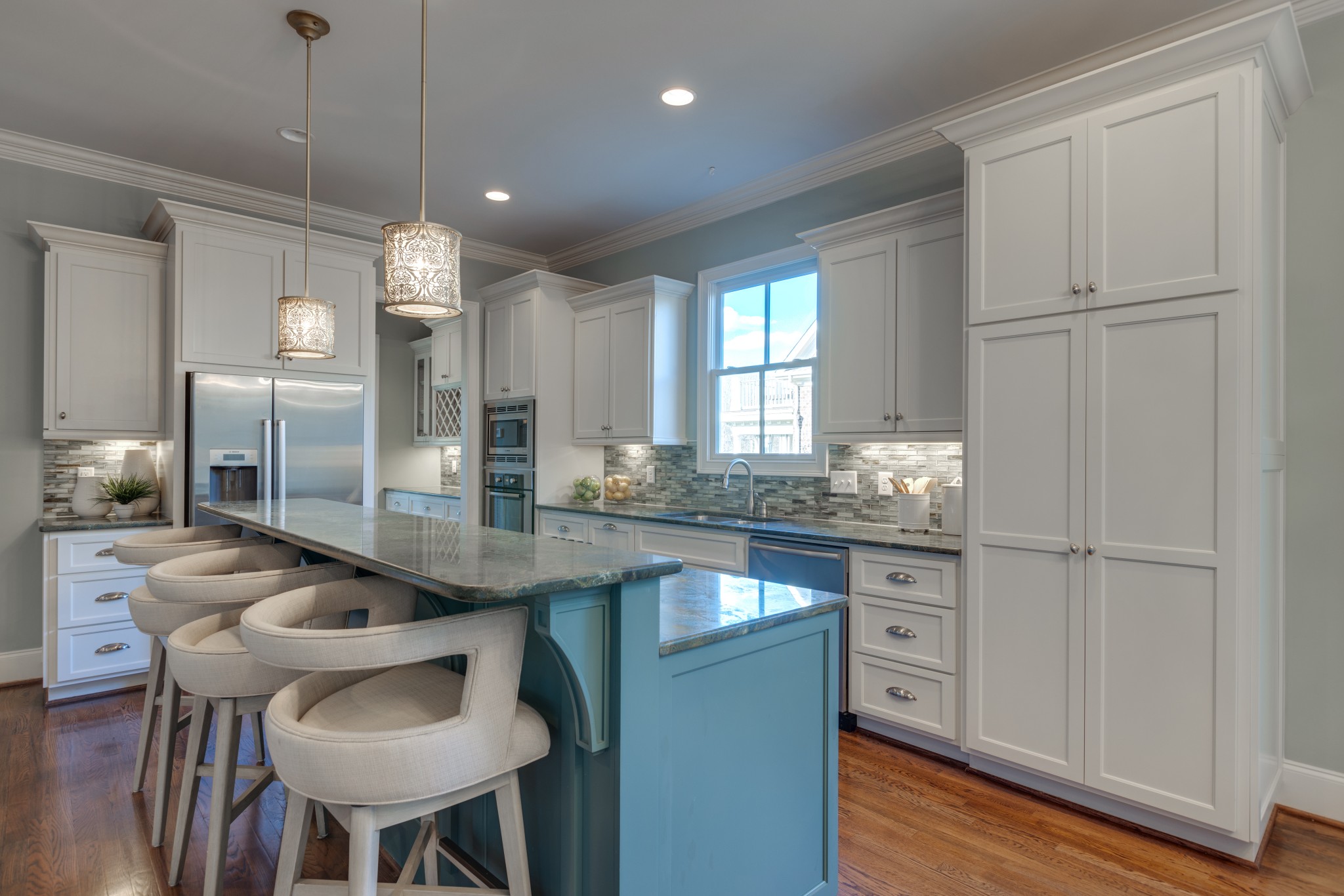 2019 Tabitha Drive Franklin, TN 37064 - Photo 23 of 47 a kitchen with kitchen island a counter top space a sink stainless steel appliances and cabinets