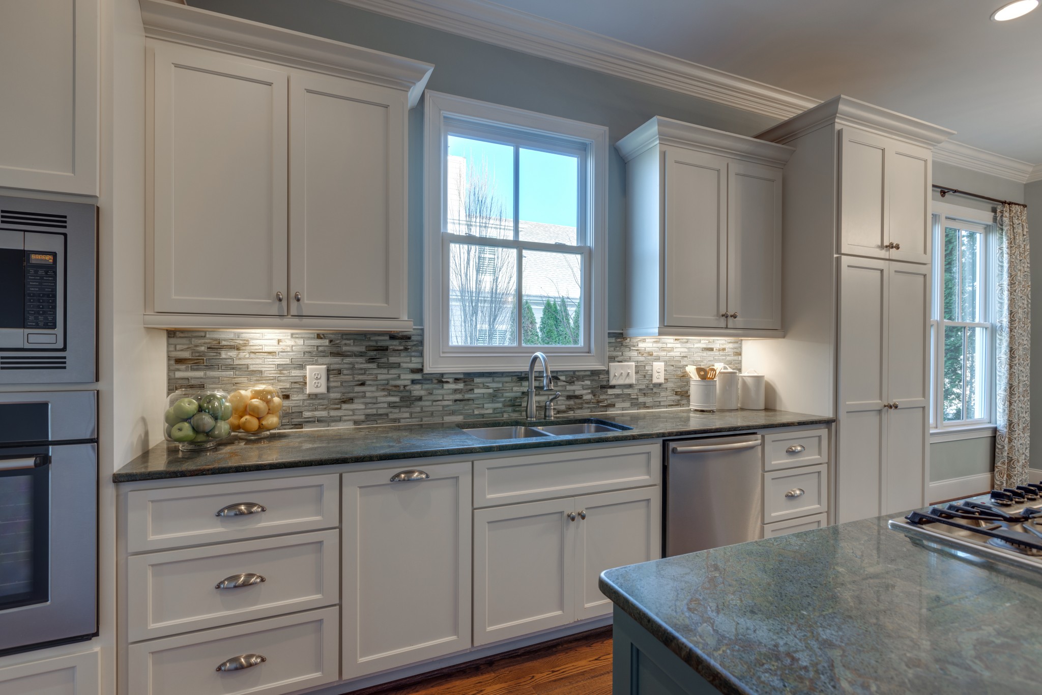 2019 Tabitha Drive Franklin, TN 37064 - Photo 26 of 47 a kitchen with granite countertop white cabinets and white appliances