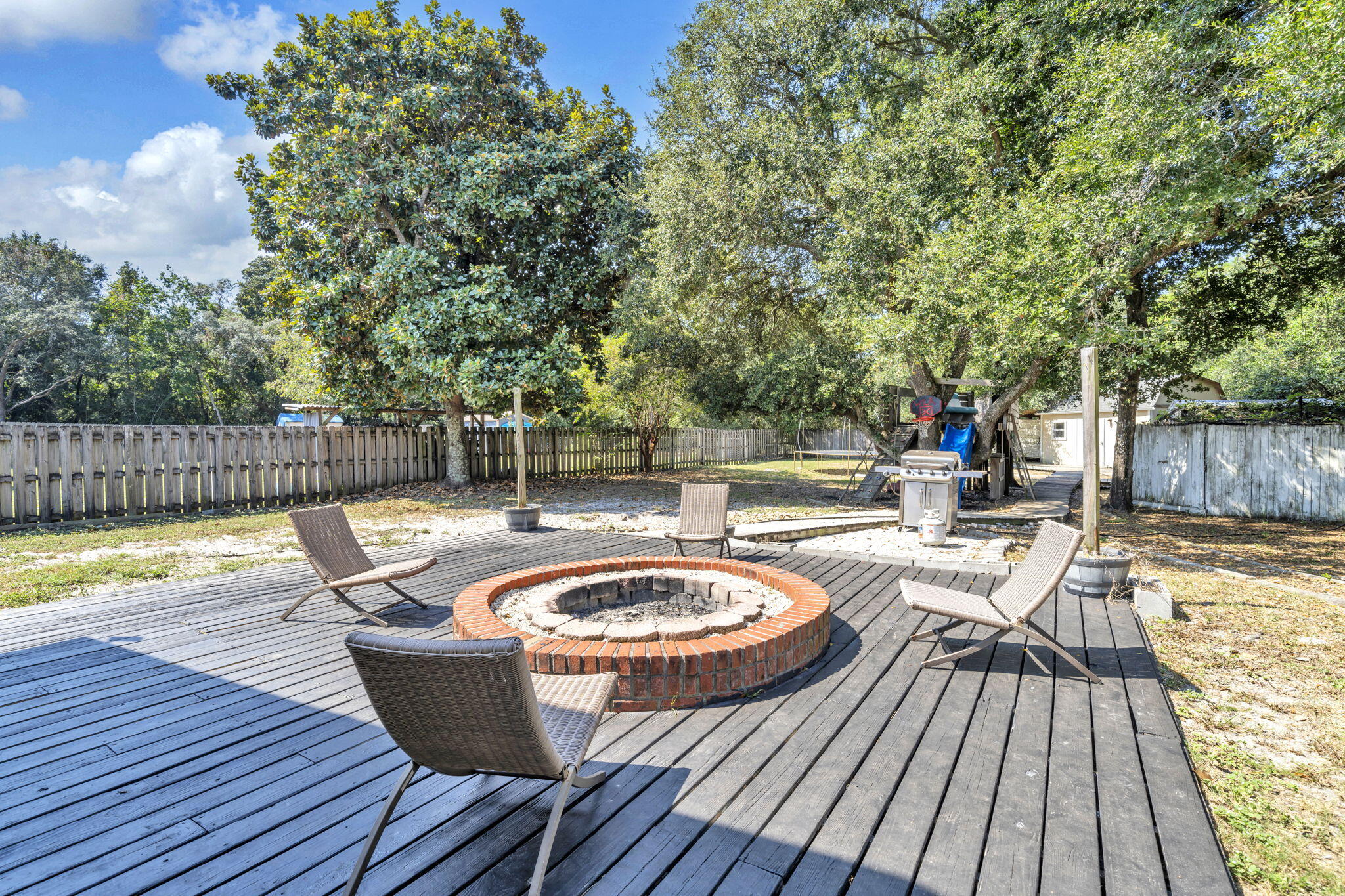 1871 Abercrombie Road Gulf Breeze, FL 32563 - Photo 22 of 32 Deck and firepit