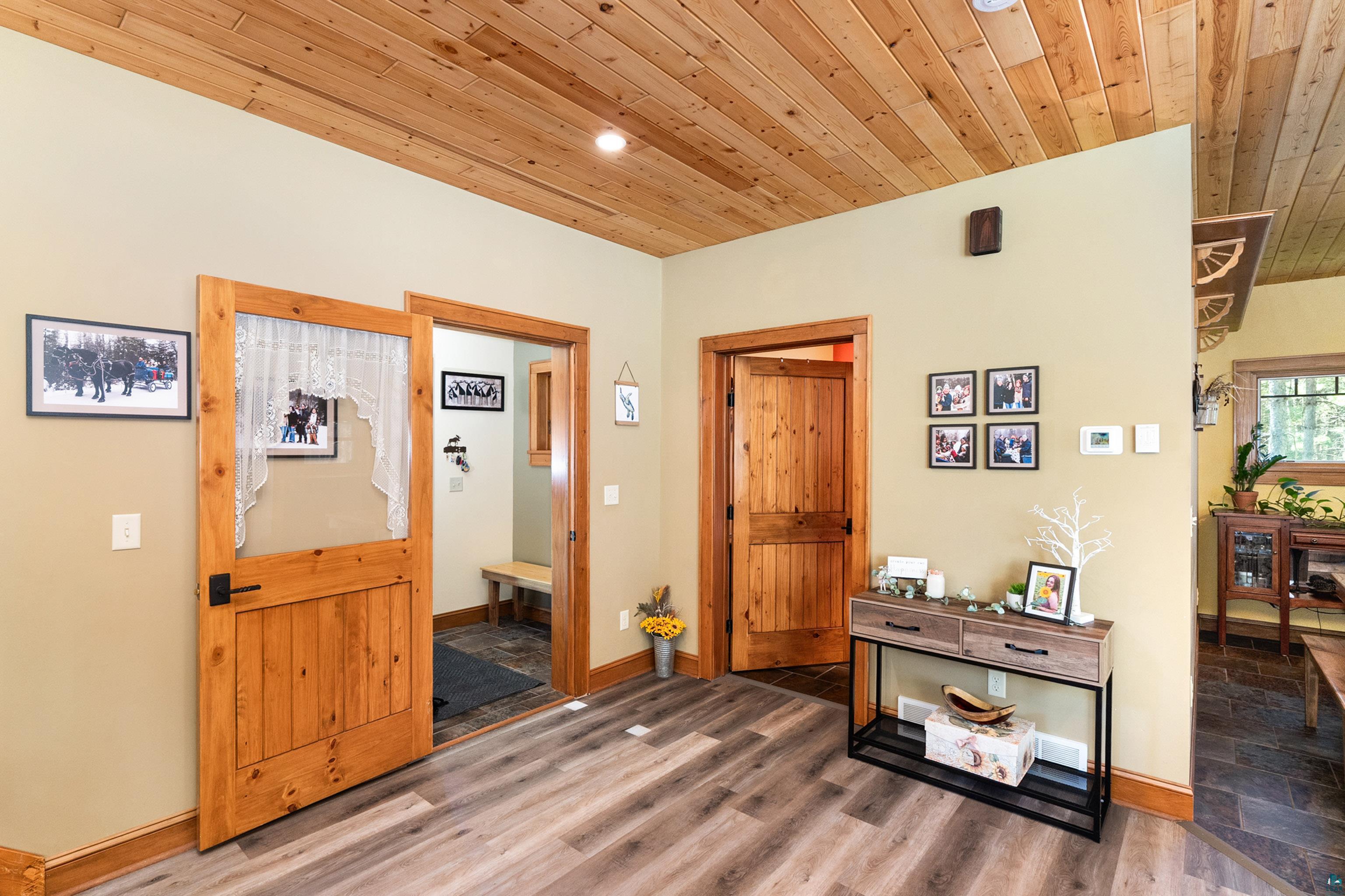 75 East Stark Road Esko, MN 55733 - Photo 9 of 87 Natural wood plank ceilings complement the light wood-finish flooring