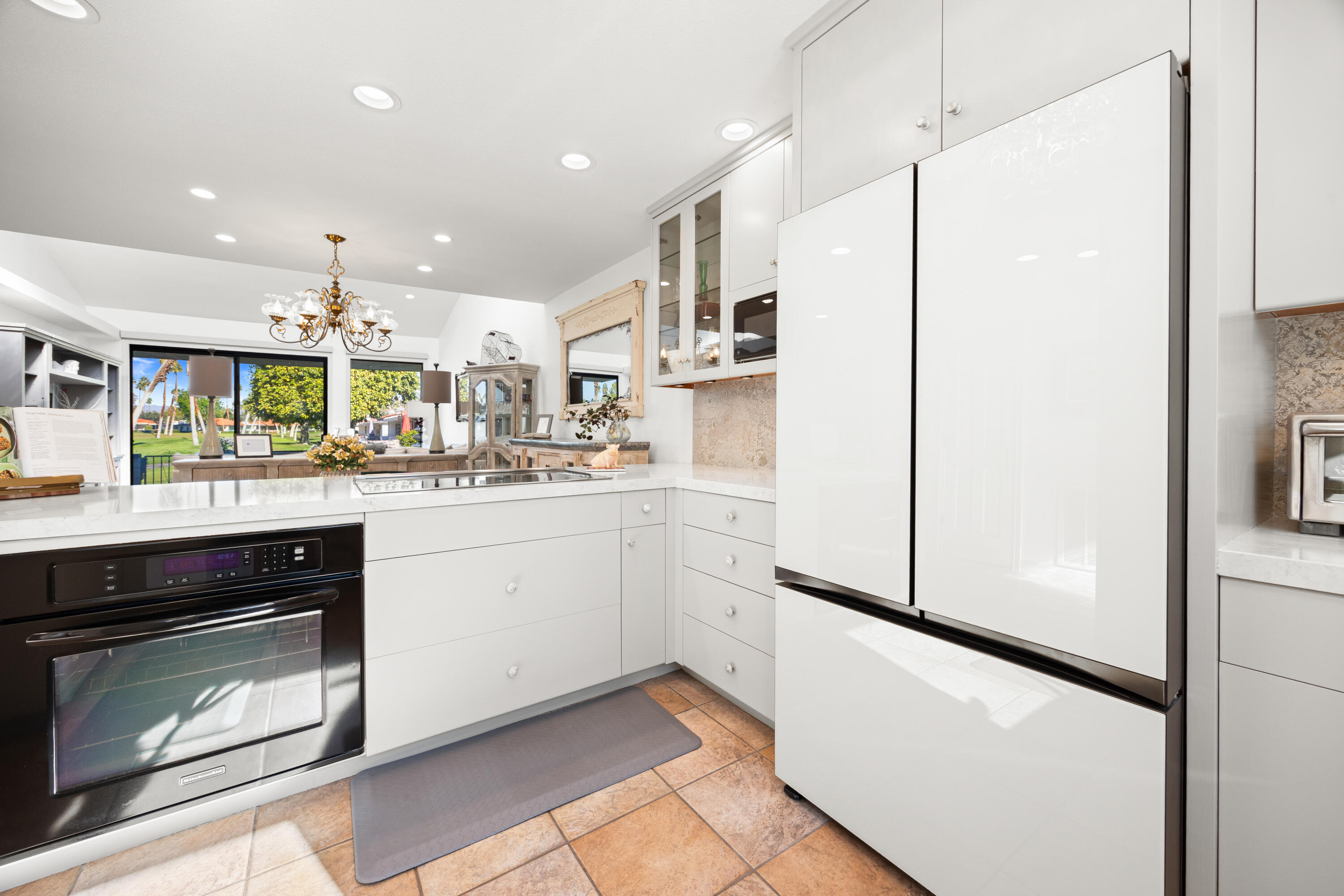 53 Marbella Drive Rancho Mirage, CA 92270 - Photo 11 of 45 a kitchen with stainless steel appliances a refrigerator sink and microwave
