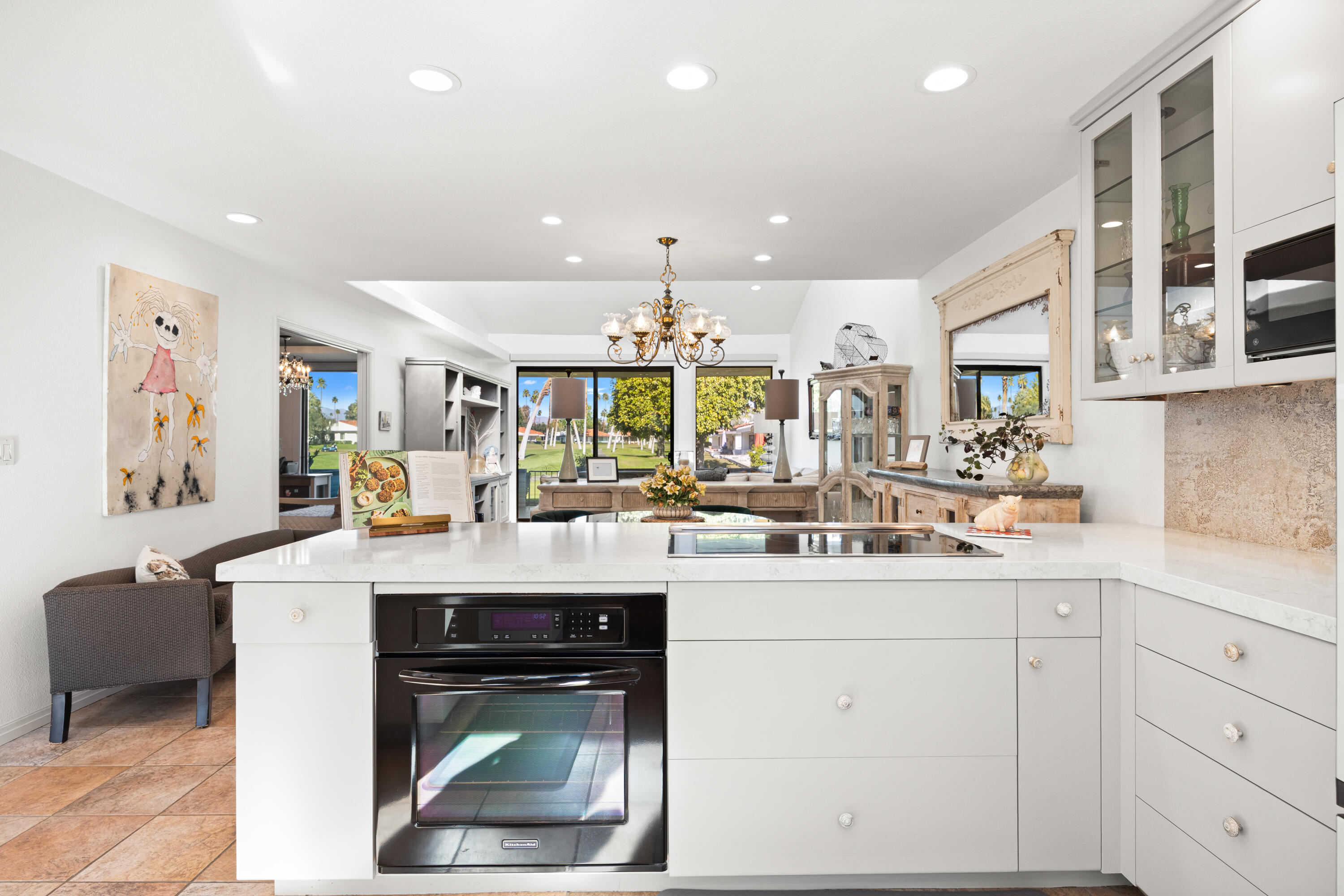 53 Marbella Drive Rancho Mirage, CA 92270 - Photo 12 of 45 a kitchen with sink cabinets and window