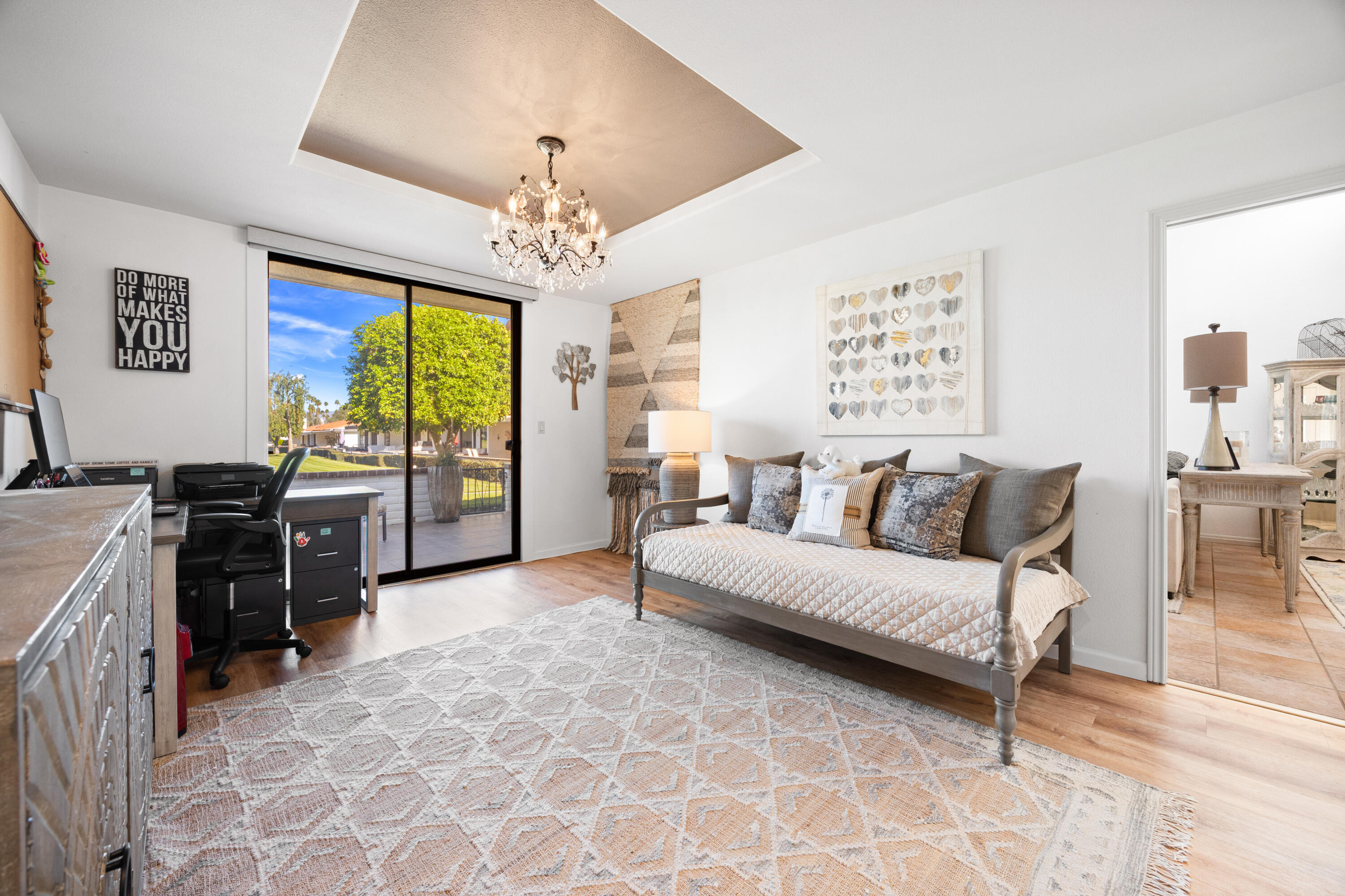 53 Marbella Drive Rancho Mirage, CA 92270 - Photo 15 of 45 a living room with furniture and a chandelier