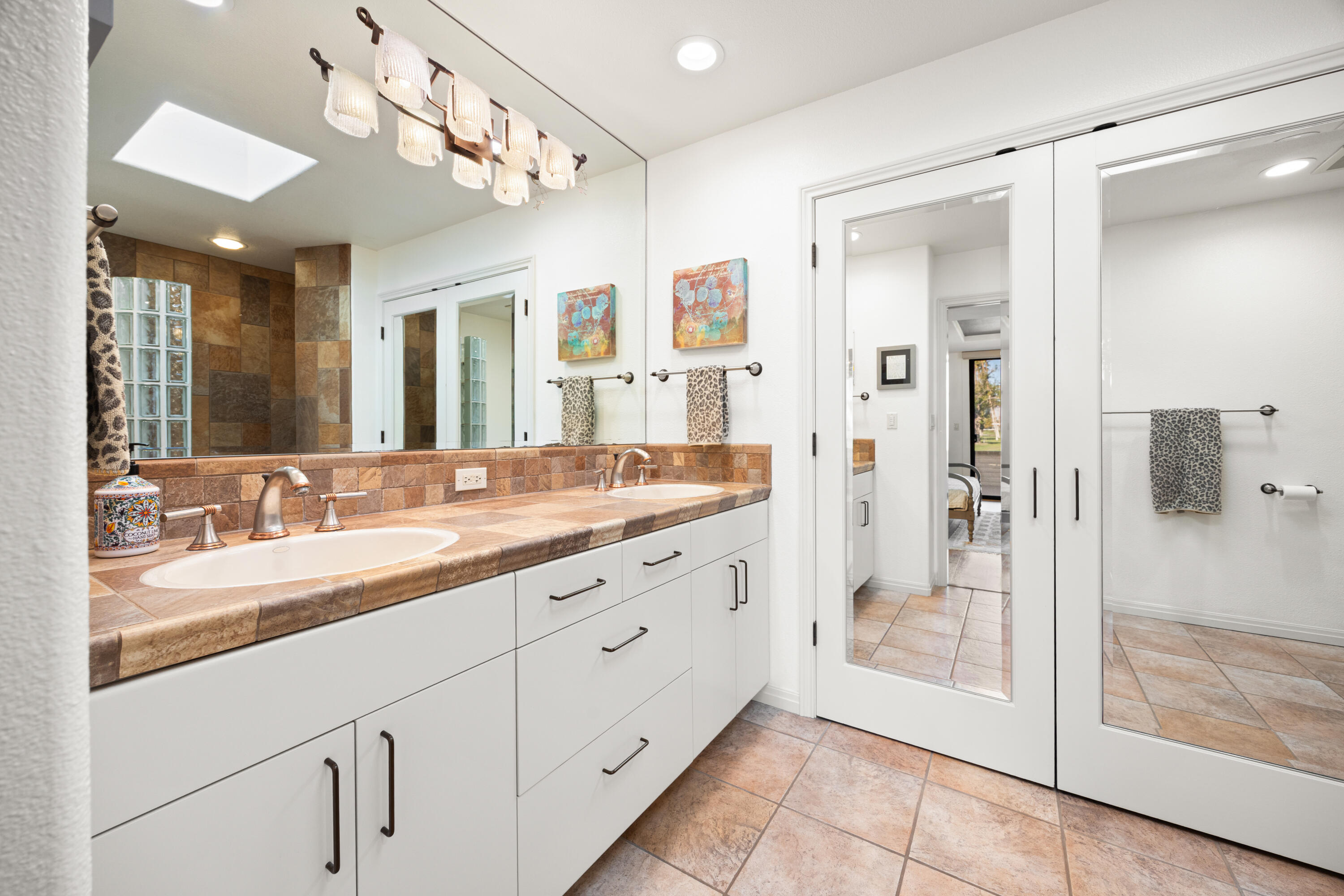 53 Marbella Drive Rancho Mirage, CA 92270 - Photo 17 of 45 a bathroom with a granite countertop sink mirror and shower