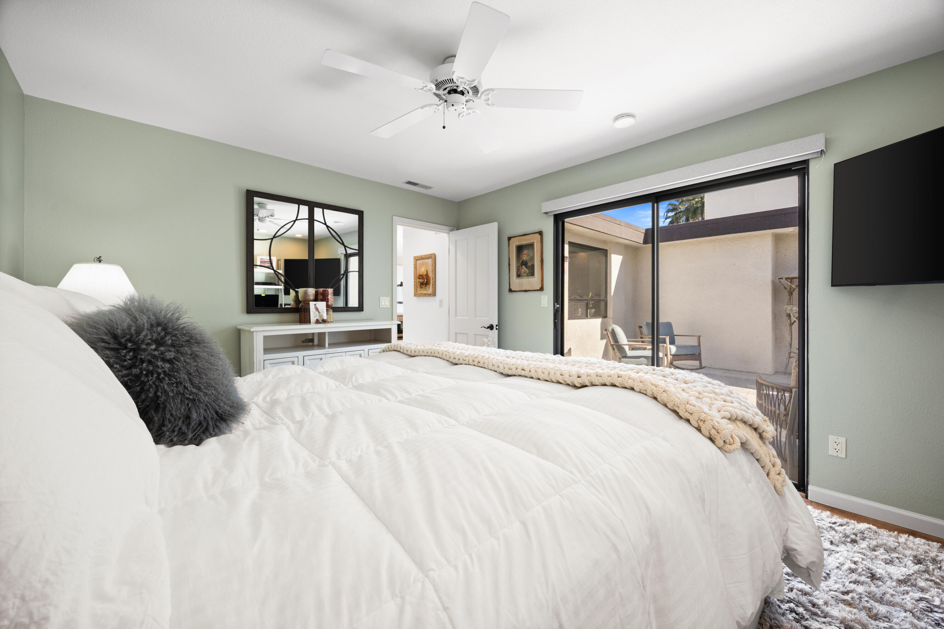 53 Marbella Drive Rancho Mirage, CA 92270 - Photo 20 of 45 a spacious bedroom with a bed and a large window