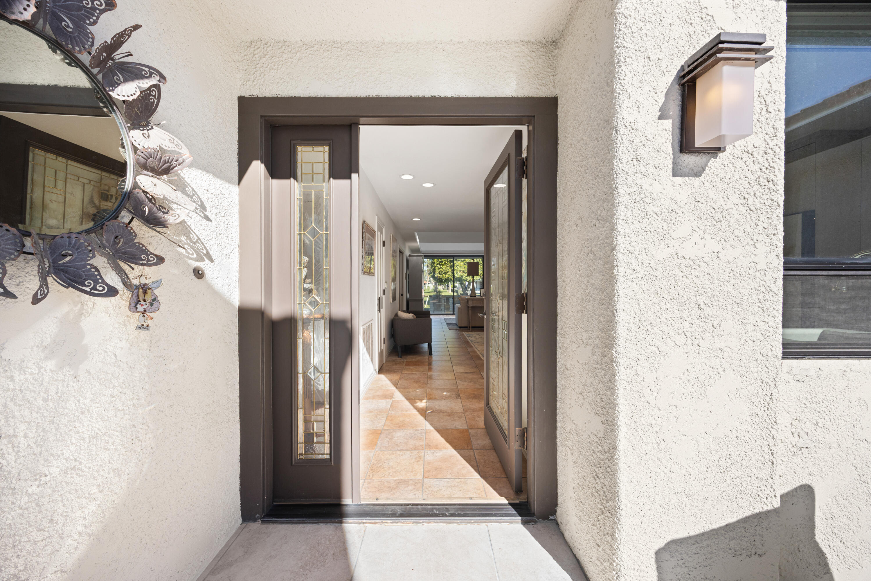 53 Marbella Drive Rancho Mirage, CA 92270 - Photo 2 of 45 a view of a hallway with wooden floor and staircase