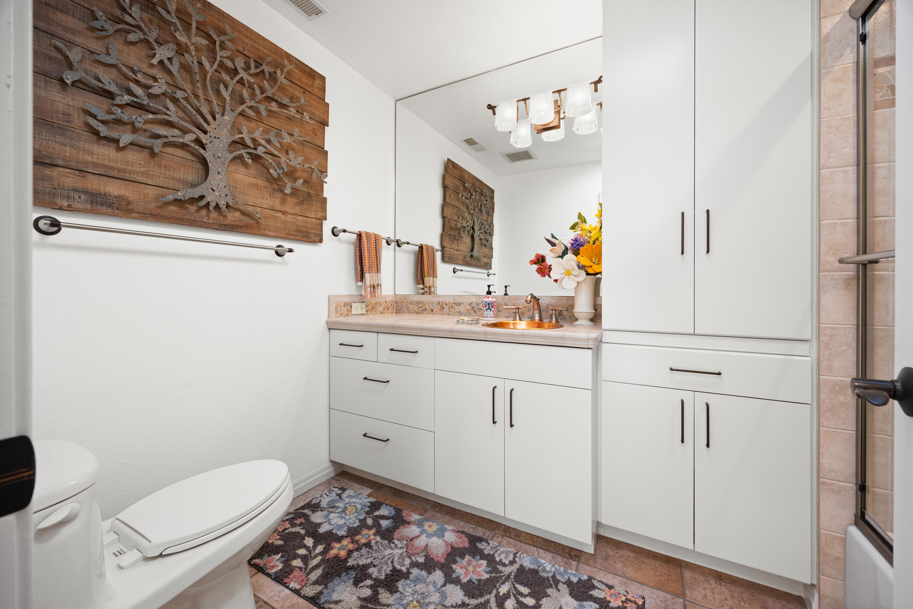 53 Marbella Drive Rancho Mirage, CA 92270 - Photo 22 of 45 a bathroom with a sink a toilet and a mirror
