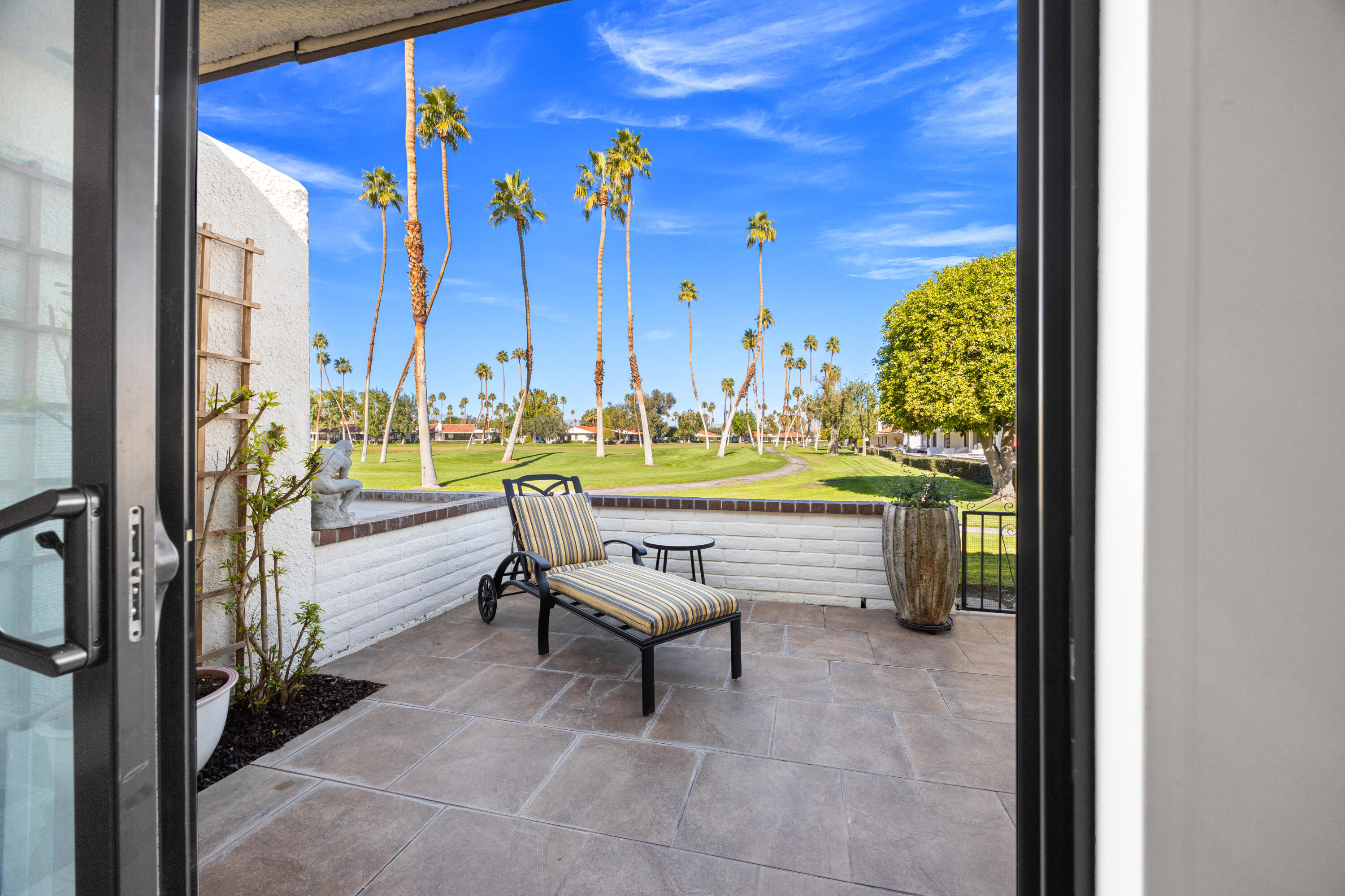 53 Marbella Drive Rancho Mirage, CA 92270 - Photo 23 of 45 a living room with couches and pool view