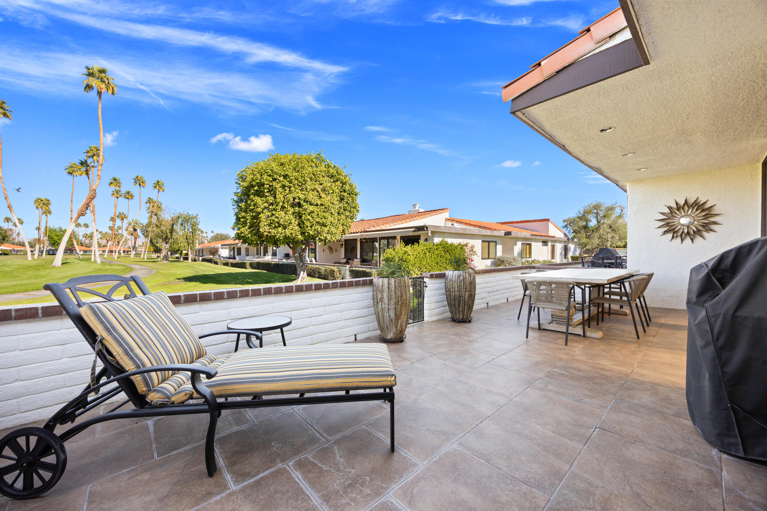 53 Marbella Drive Rancho Mirage, CA 92270 - Photo 24 of 45 a outdoor living space with furniture and a potted plant