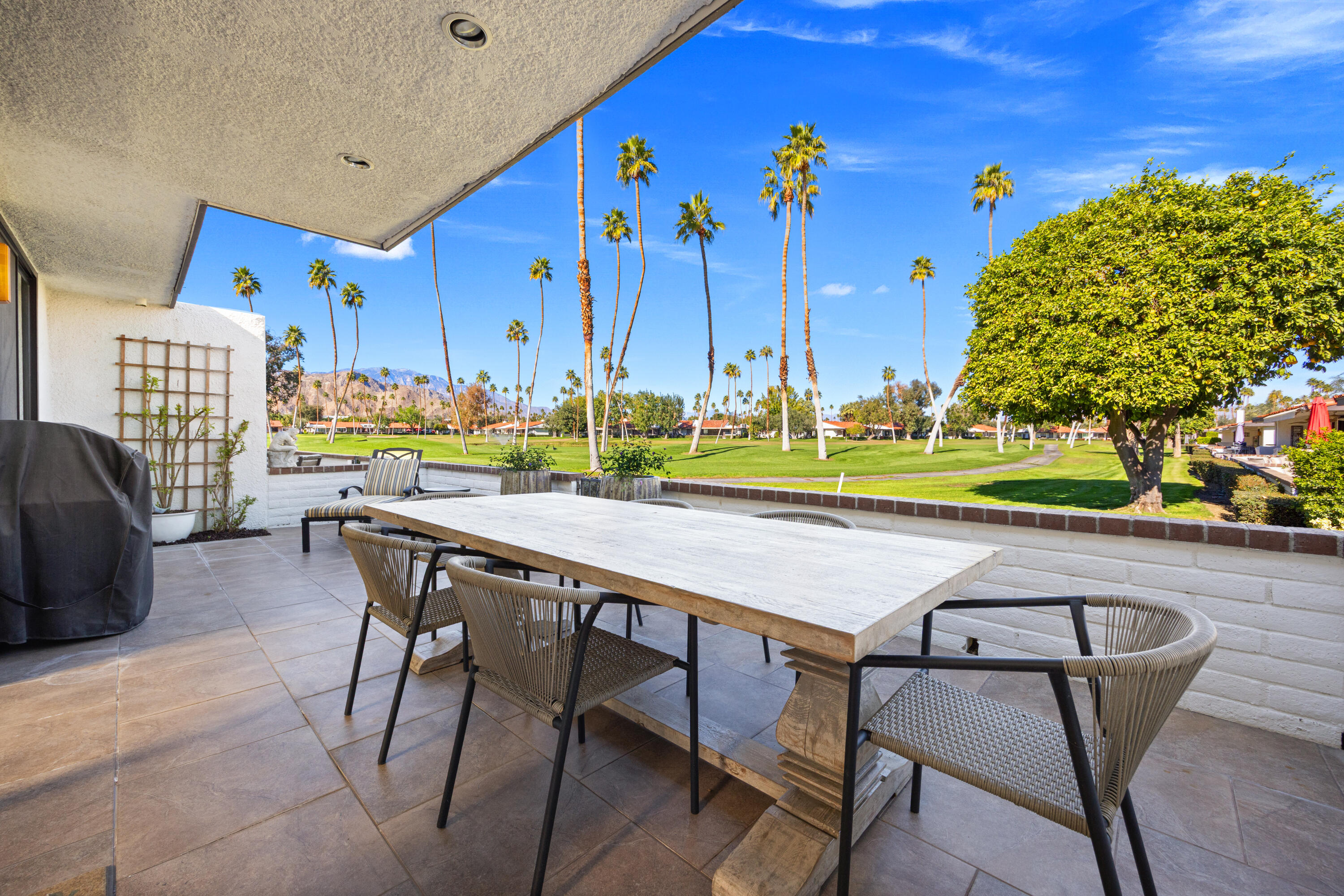53 Marbella Drive Rancho Mirage, CA 92270 - Photo 25 of 45 a view of an chairs and tables in patio