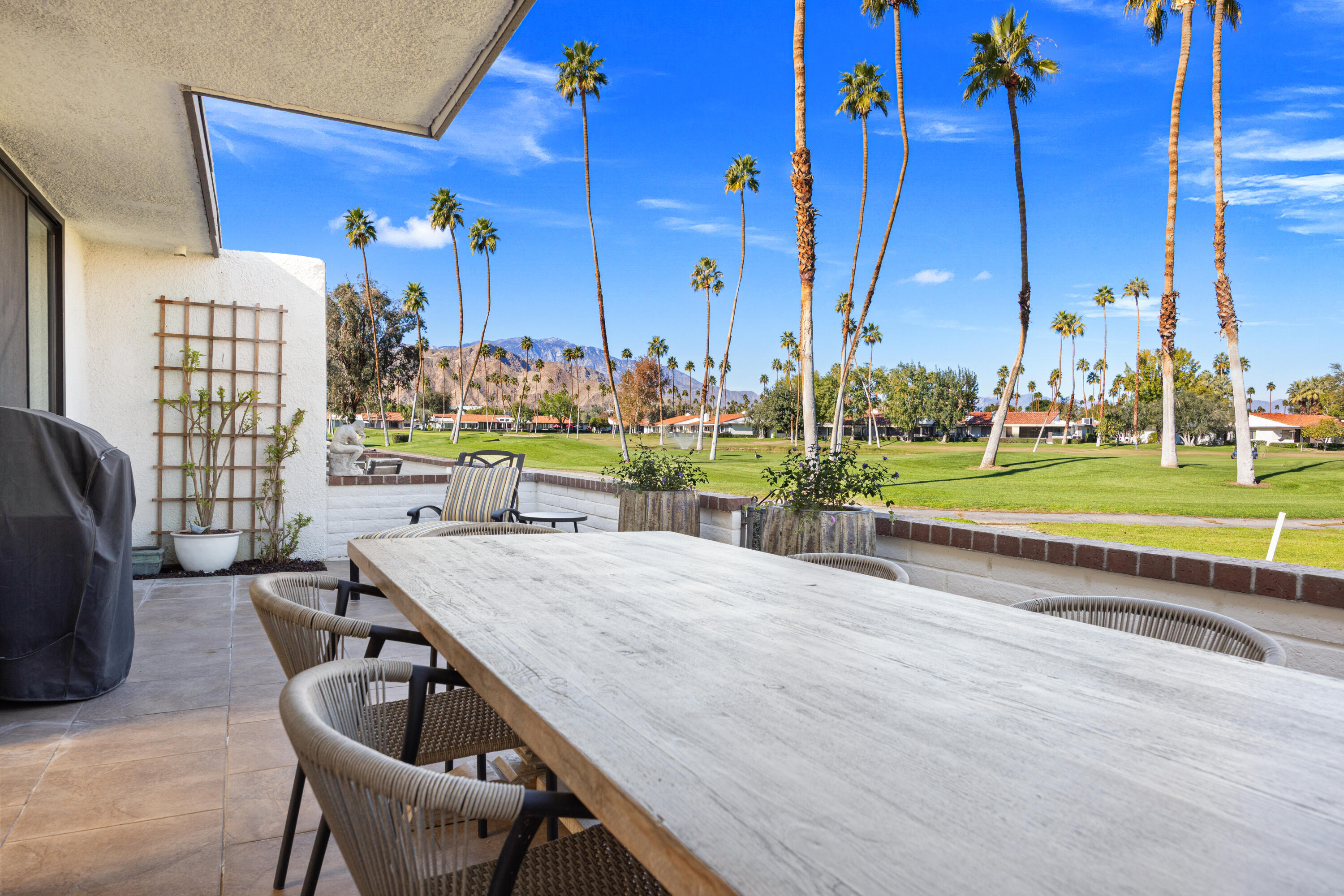 53 Marbella Drive Rancho Mirage, CA 92270 - Photo 26 of 45 a view of a patio with a table and chairs