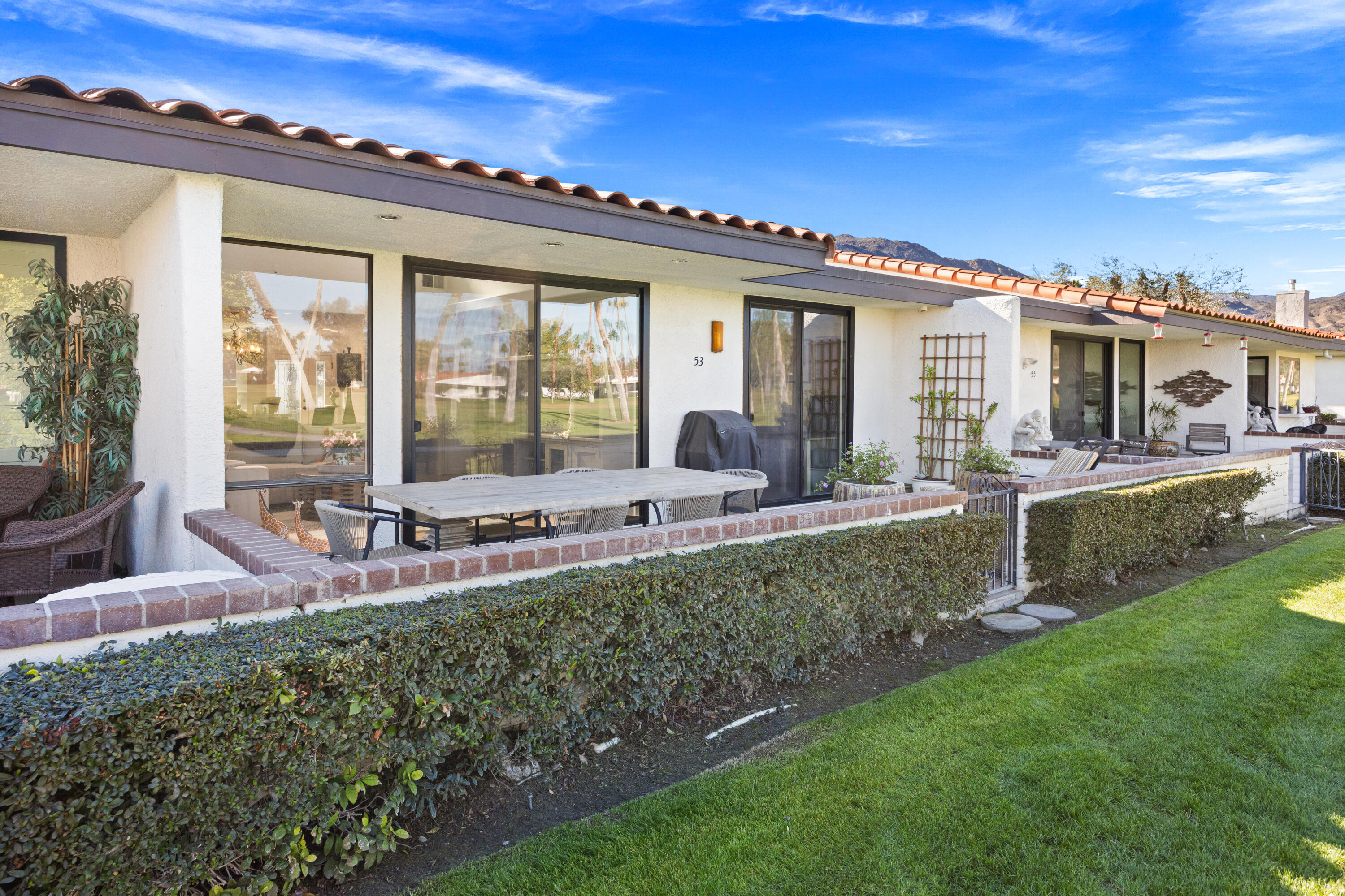 53 Marbella Drive Rancho Mirage, CA 92270 - Photo 33 of 45 a front view of house with yard and outdoor seating