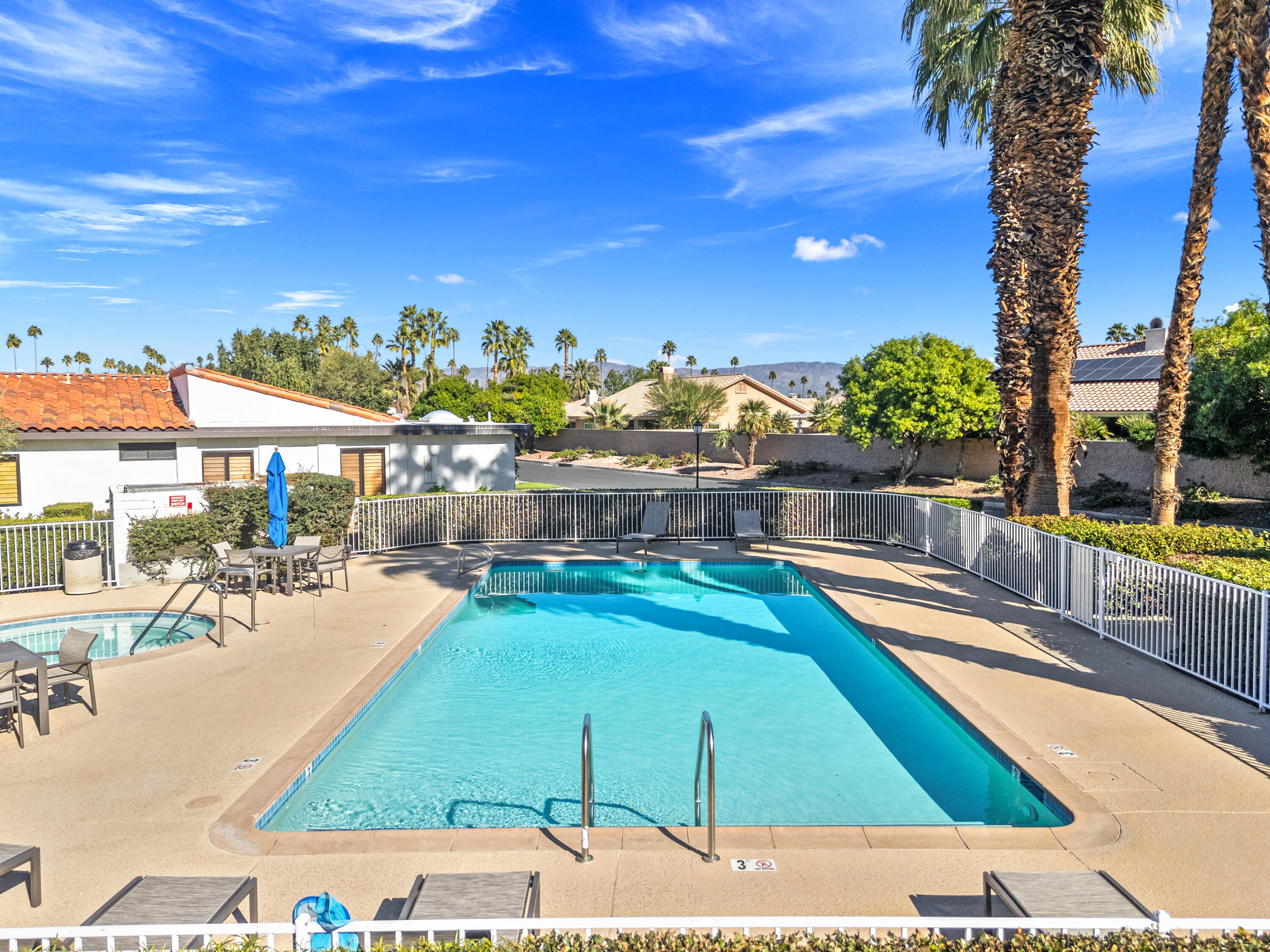 53 Marbella Drive Rancho Mirage, CA 92270 - Photo 42 of 45 a view of a swimming pool with an outdoor seating