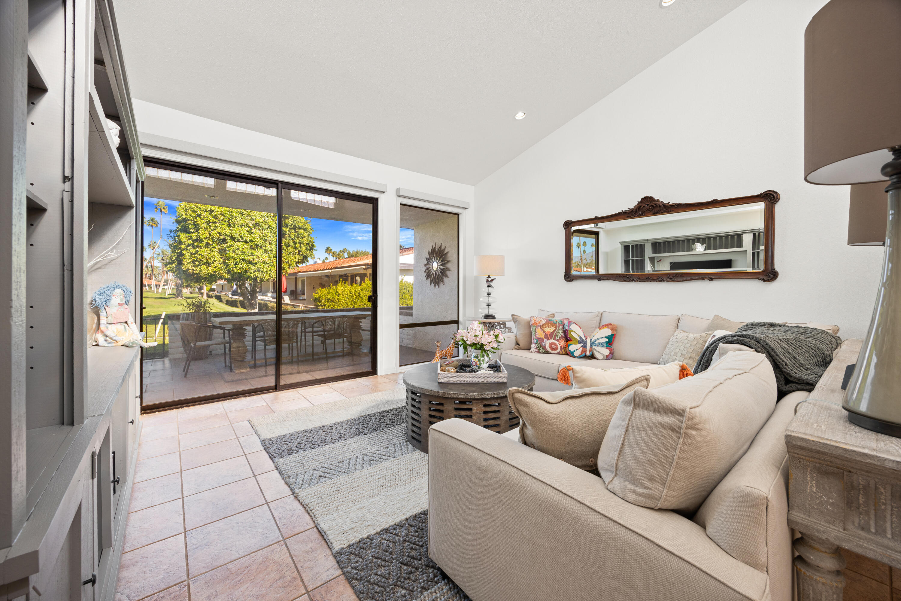 53 Marbella Drive Rancho Mirage, CA 92270 - Photo 7 of 45 a living room with furniture floor to ceiling window and a flat screen tv