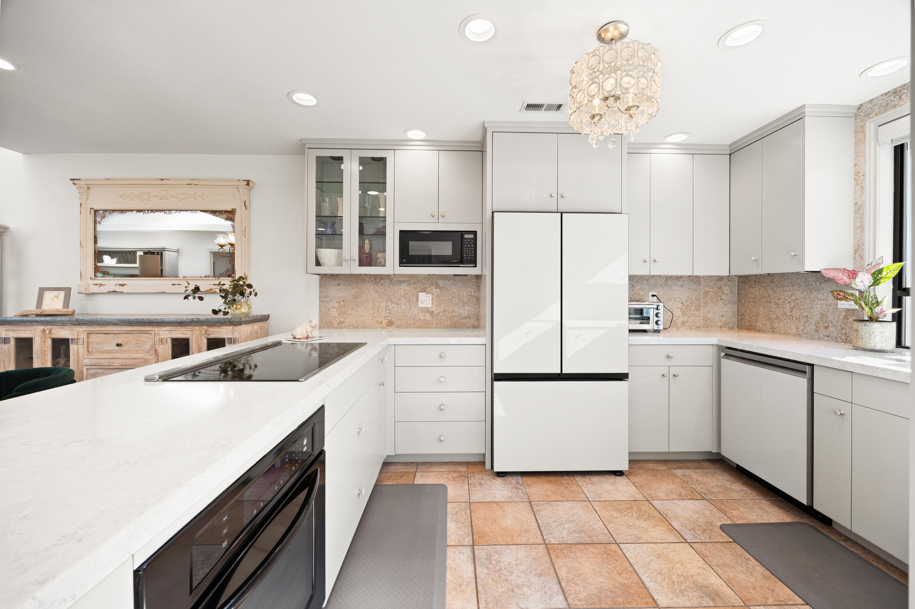 53 Marbella Drive Rancho Mirage, CA 92270 - Photo 10 of 45 a kitchen with a sink a counter top space stainless steel appliances and cabinets