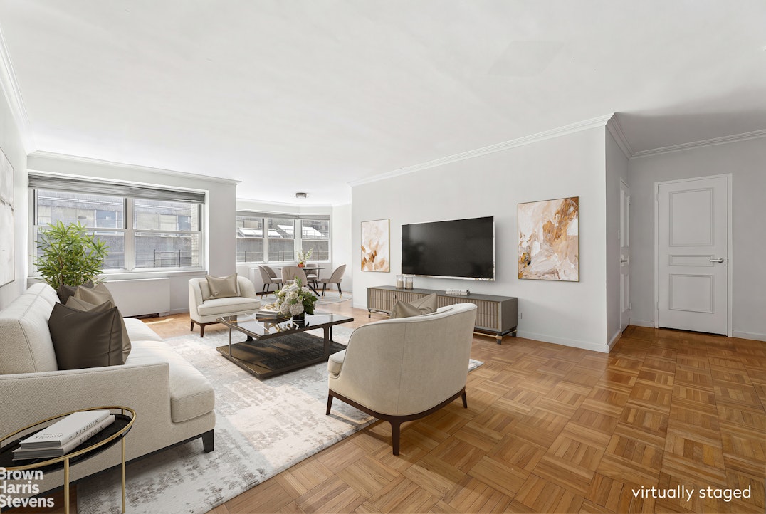 35 East 75th Street, Unit 11AB Manhattan, NY 10021 - Photo 6 of 12 a living room with furniture and a flat screen tv