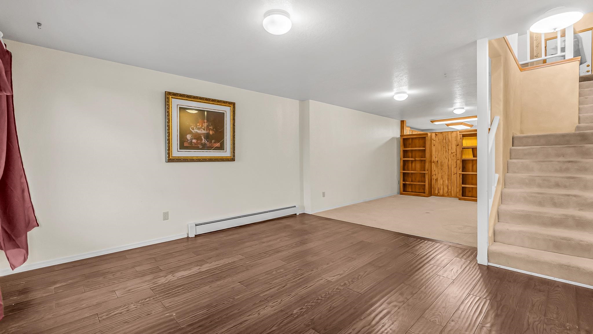 12 West Ridge Court Parachute, CO 81635 - Photo 15 of 37 a view of an empty room with wooden floor and a window