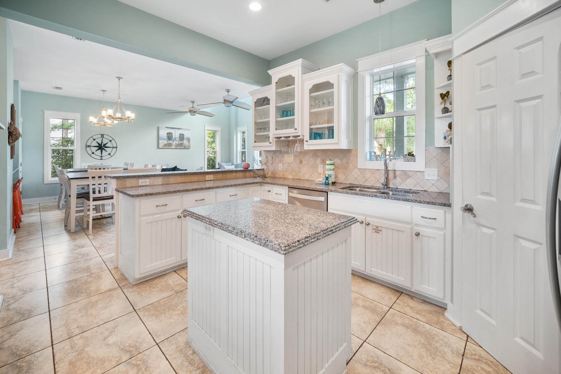 56 Dune Ridge Road Santa Rosa Beach, FL 32459 - Photo 12 of 65 a kitchen with granite countertop a sink and cabinets