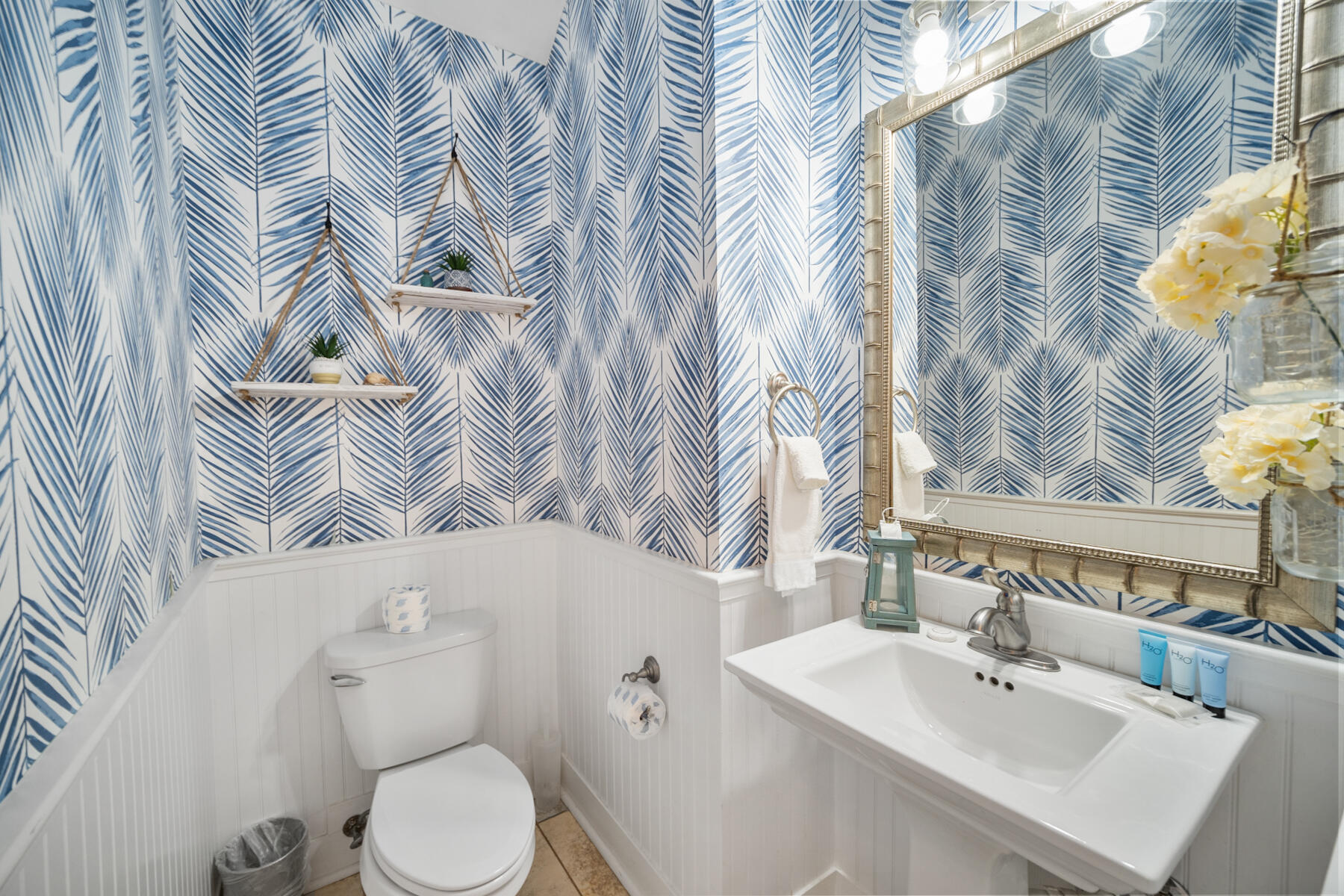 56 Dune Ridge Road Santa Rosa Beach, FL 32459 - Photo 18 of 65 a white toilet sitting next to a bathroom sink