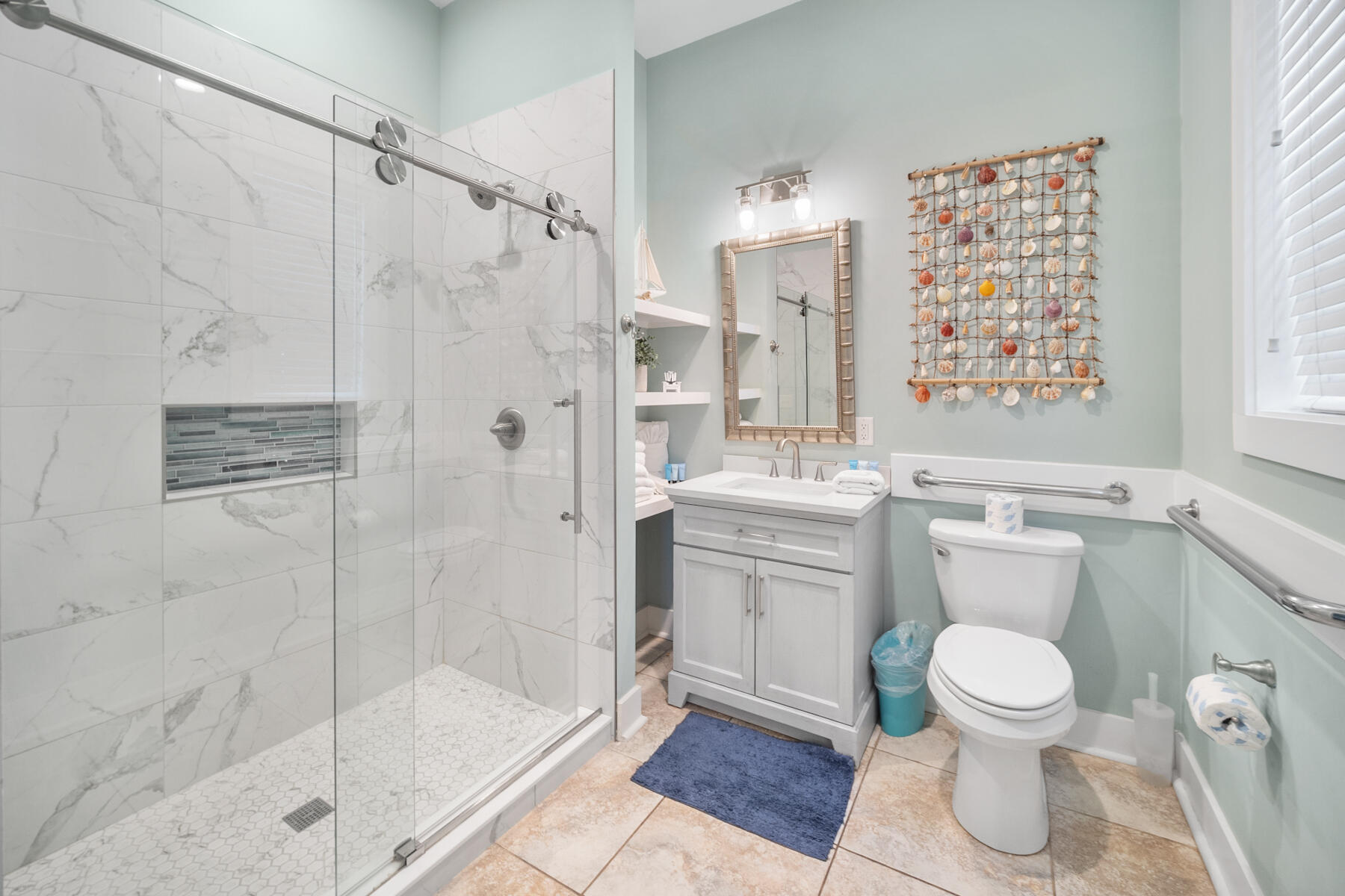 56 Dune Ridge Road Santa Rosa Beach, FL 32459 - Photo 21 of 65 a bathroom with a toilet sink and shower