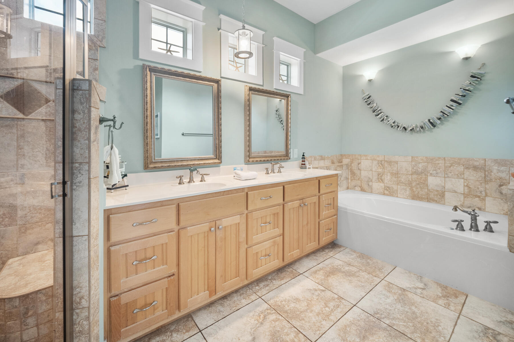 56 Dune Ridge Road Santa Rosa Beach, FL 32459 - Photo 29 of 65 a spacious bathroom with a double vanity sink a mirror and a bathtub