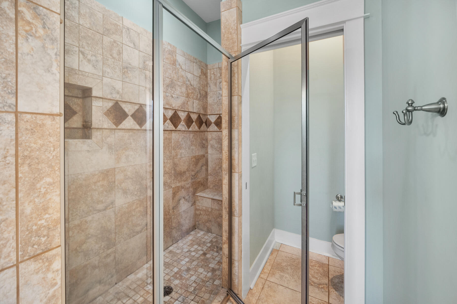 56 Dune Ridge Road Santa Rosa Beach, FL 32459 - Photo 32 of 65 a bathroom with a glass shower door