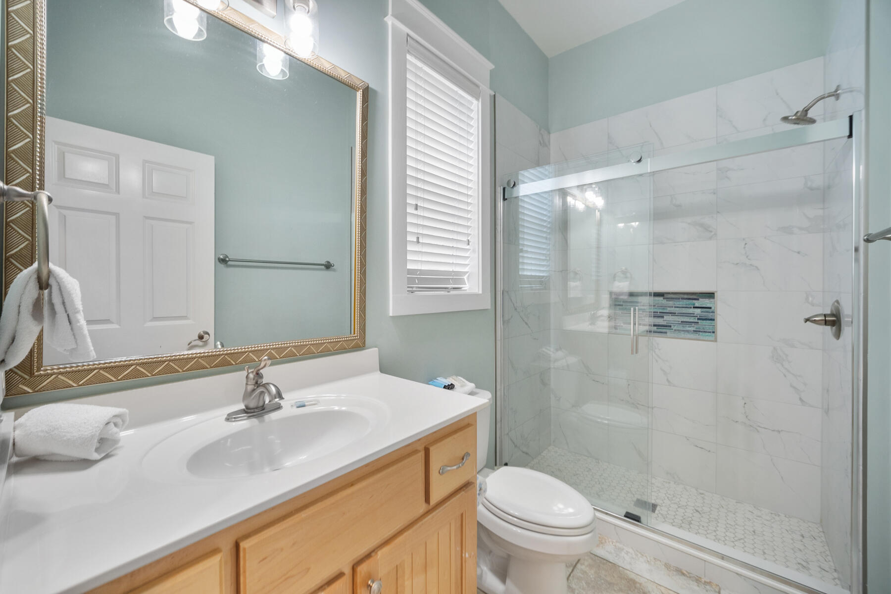 56 Dune Ridge Road Santa Rosa Beach, FL 32459 - Photo 39 of 65 a bathroom with a sink toilet and shower