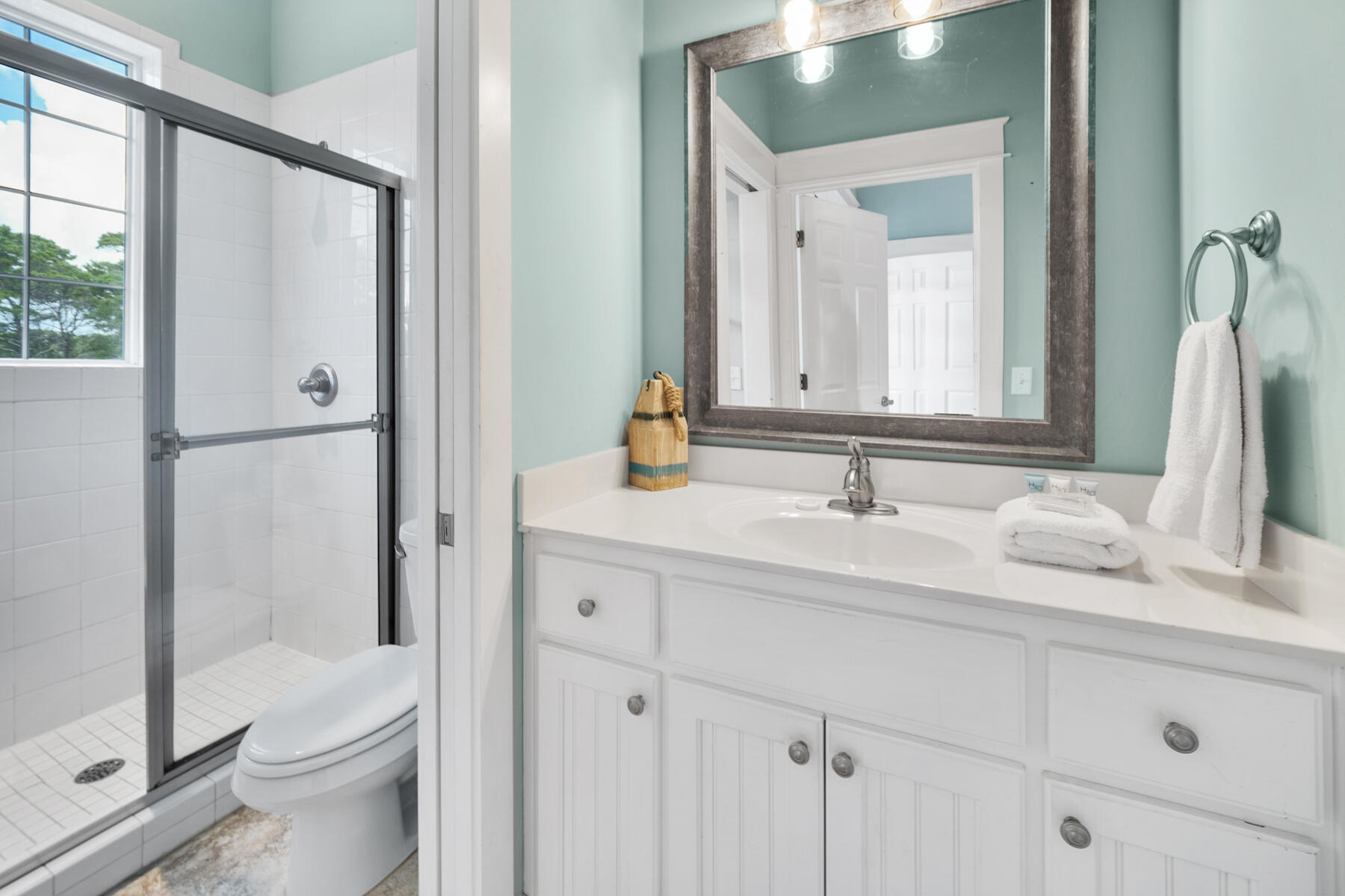 56 Dune Ridge Road Santa Rosa Beach, FL 32459 - Photo 48 of 65 a bathroom with a sink and a mirror