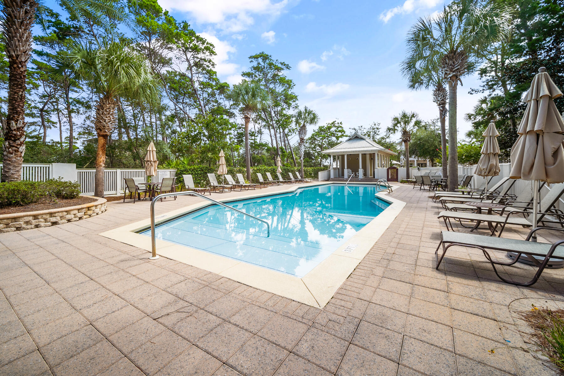 56 Dune Ridge Road Santa Rosa Beach, FL 32459 - Photo 56 of 65 a view of a swimming pool with a lounge chairs