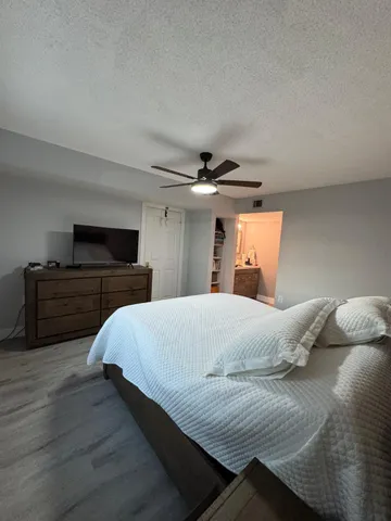 a bedroom with a bed and dresser