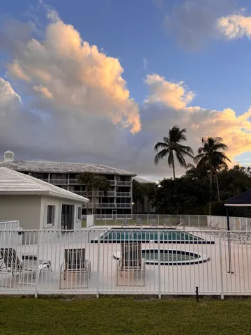 a view of a house with a wooden deck