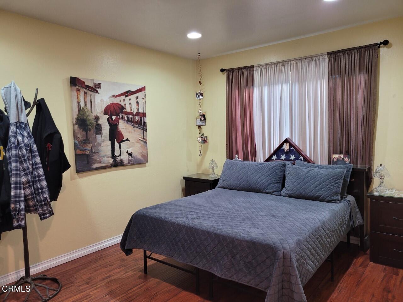 521 West Bard Road Oxnard, CA 93033 - Photo 8 of 19 a bedroom with a large bed and a window