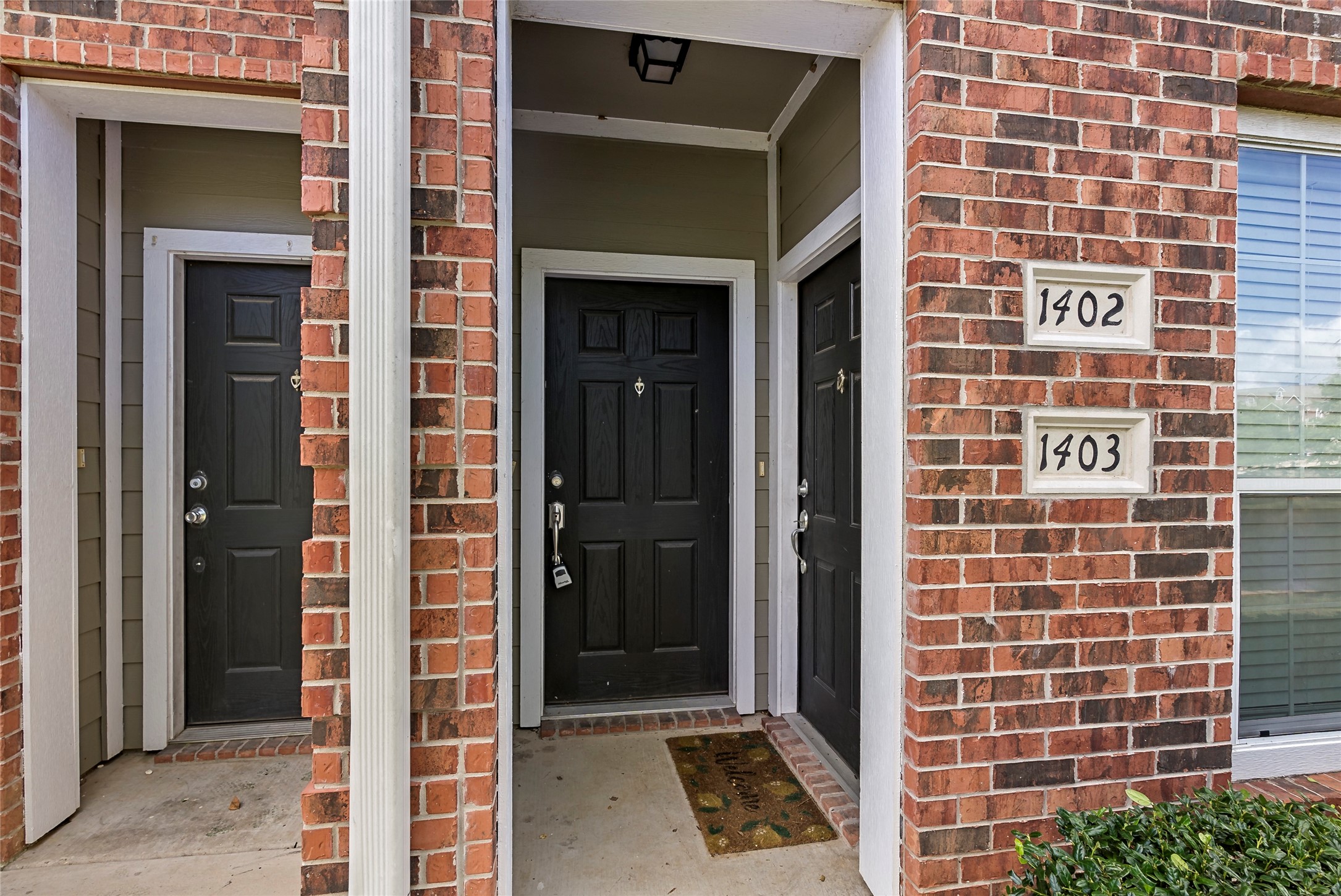 1198 Jones-Butler Road, Unit 1402 College Station, TX 77840 - Photo 11 of 21 a view of a door with brick walls