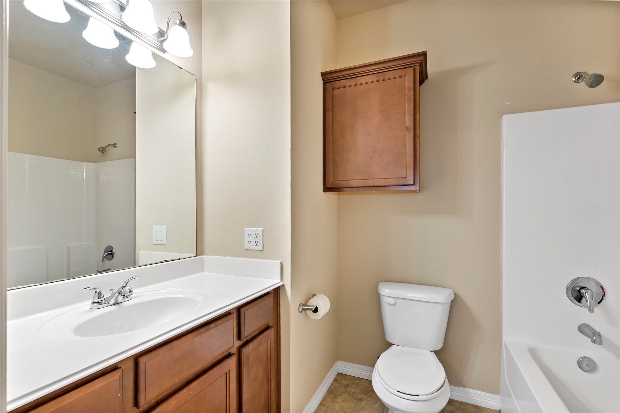 1198 Jones-Butler Road, Unit 1402 College Station, TX 77840 - Photo 2 of 21 a bathroom with a sink a toilet and shower