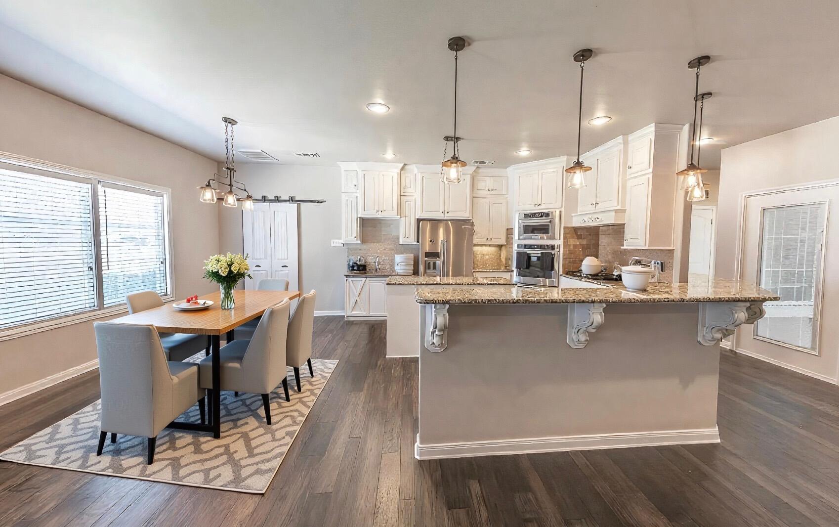 1 Highland Drive Ransom Canyon, TX 79366 - Photo 9 of 27 a large kitchen with a table and chairs