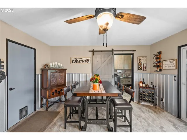 a dining room with furniture and window