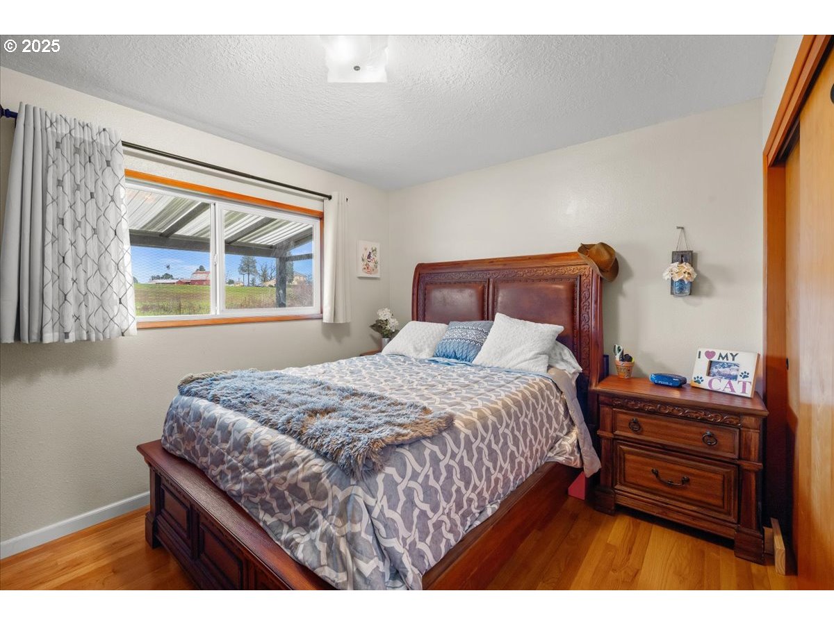 39449 Northwest Wilkesboro Road Banks, OR 97106 - Photo 20 of 45 a bedroom with a bed table and window