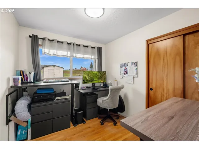 a kitchen with a stove a refrigerator and a dining table