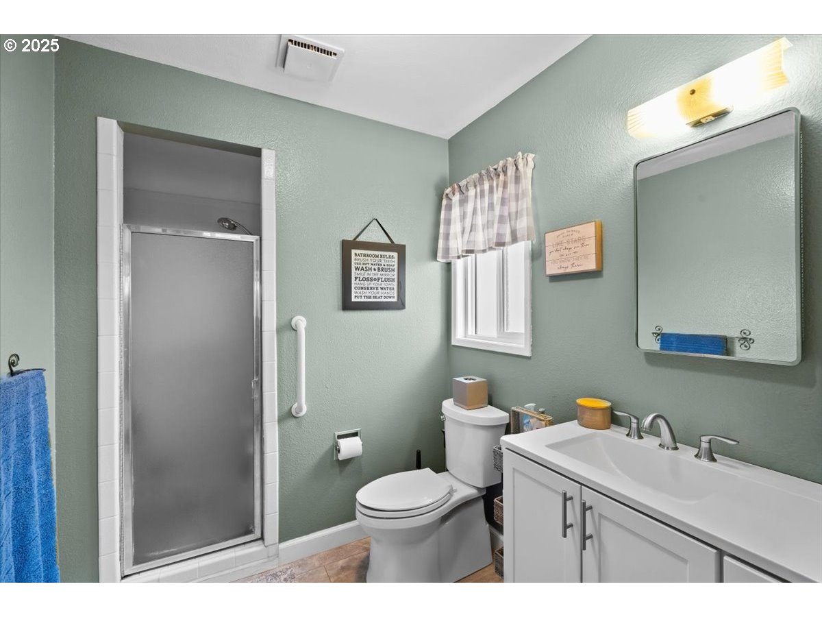 39449 Northwest Wilkesboro Road Banks, OR 97106 - Photo 29 of 45 a bathroom with a sink toilet and shower