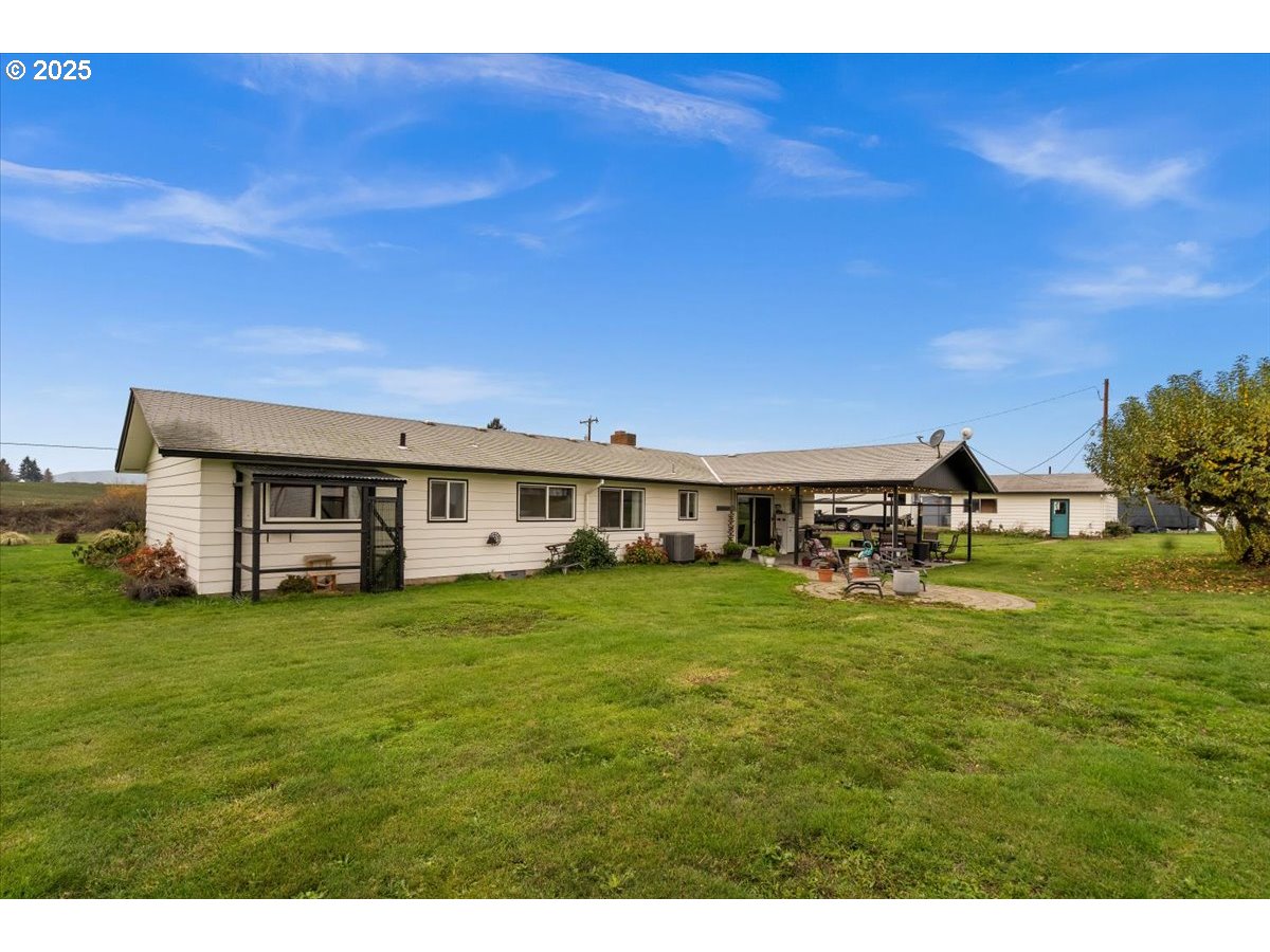 39449 Northwest Wilkesboro Road Banks, OR 97106 - Photo 34 of 45 a view of a big house with a big yard and large trees