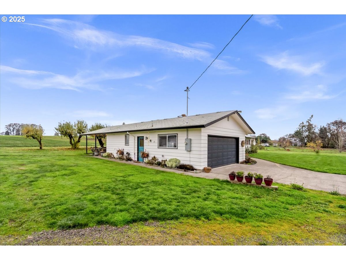 39449 Northwest Wilkesboro Road Banks, OR 97106 - Photo 39 of 45 a front view of house with yard and green space