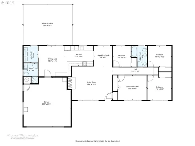 a picture of a room with a white refrigerator and white walls