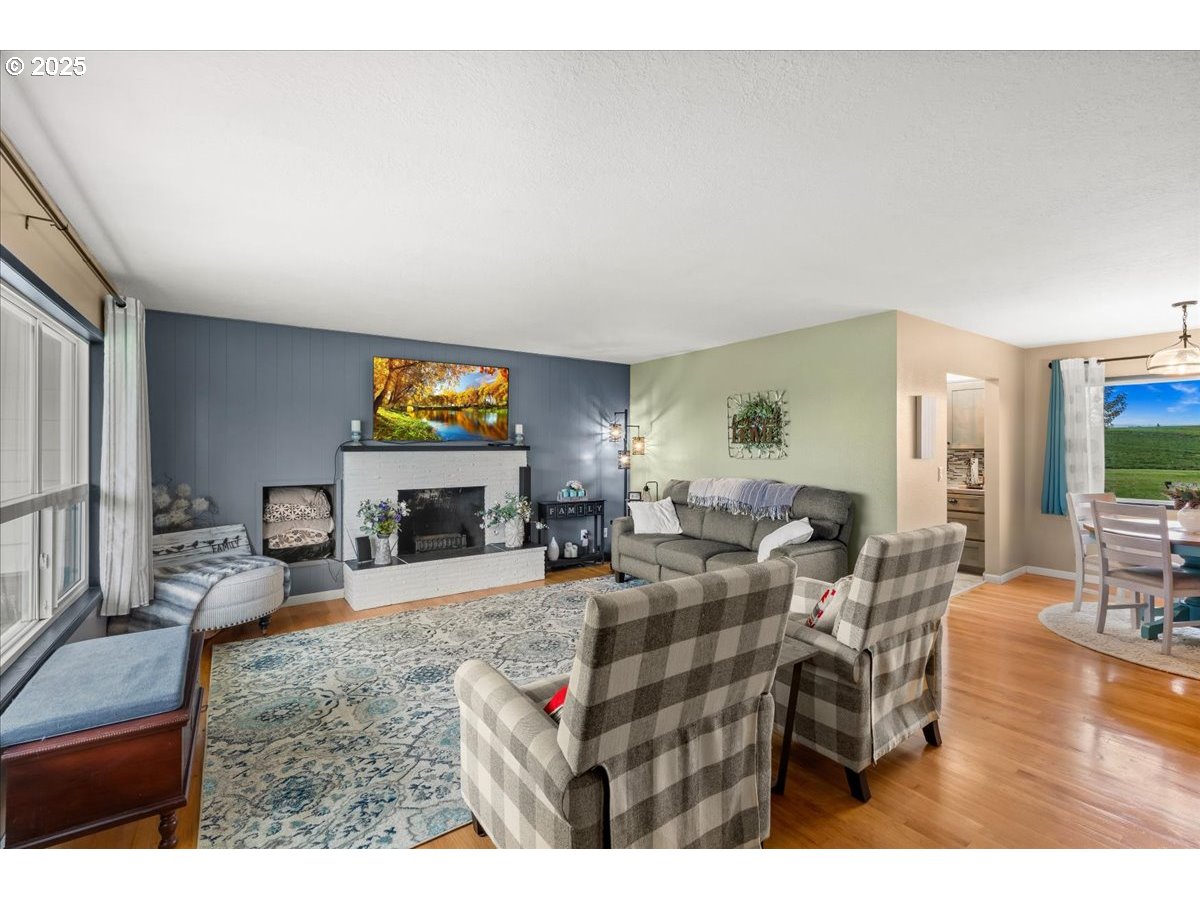 39449 Northwest Wilkesboro Road Banks, OR 97106 - Photo 6 of 45 a living room with fireplace furniture and a flat screen tv