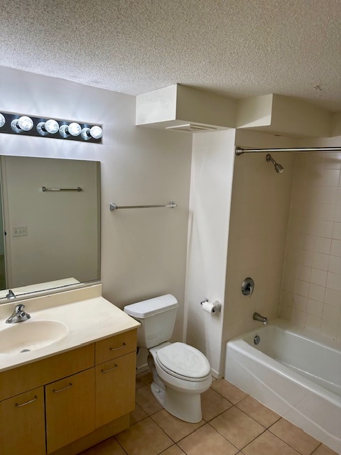 800 Elgin Road, Unit 1414 Evanston, IL 60201 - Photo 6 of 9 a bathroom with a sink a toilet and shower