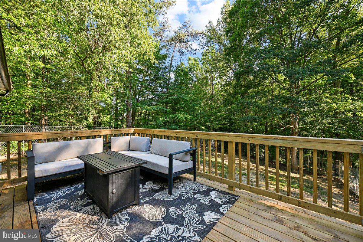 39875 Golden Beach Road Mechanicsville, MD 20659 - Photo 4 of 30 Serene deck nestled in lush greenery.