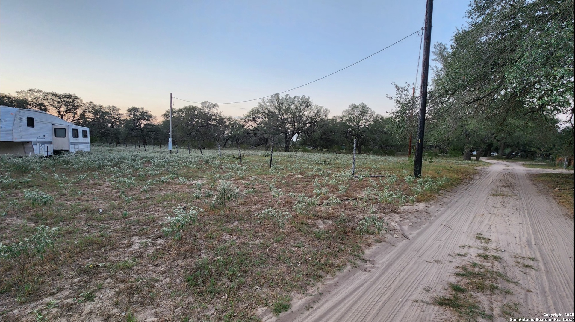 0 Hardy Road Elmendorf, TX 78112 - Photo 6 of 27 a view of outdoor space with green field and trees