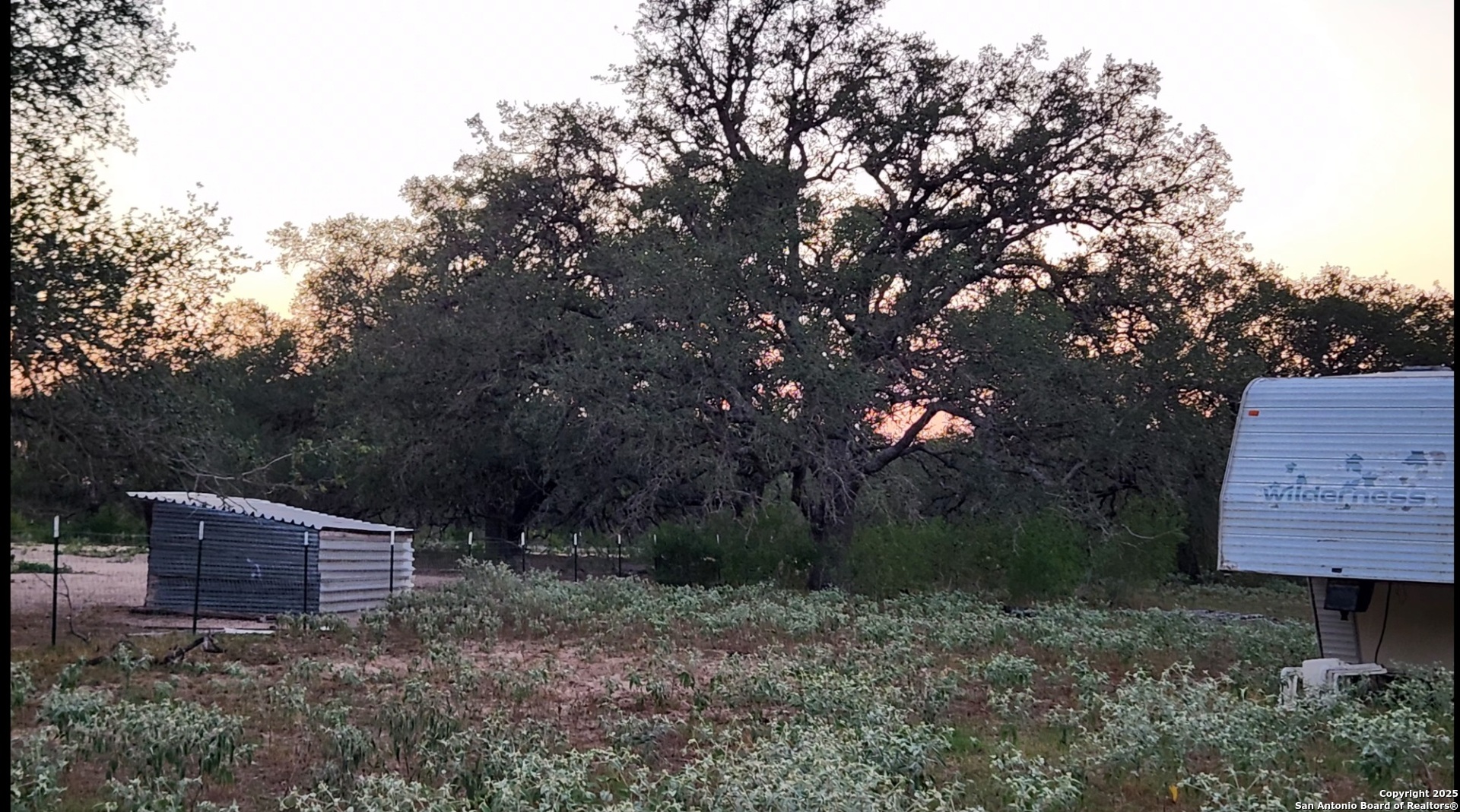 0 Hardy Road Elmendorf, TX 78112 - Photo 7 of 27 a backyard of a house with lots of green space
