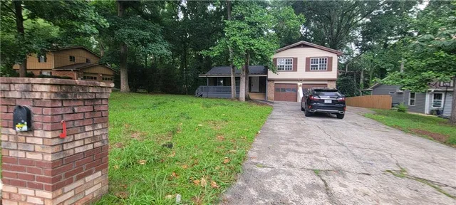a view of house with outdoor space
