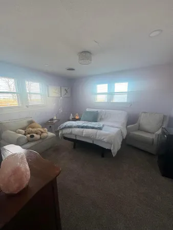a bedroom with bed or couch and a window