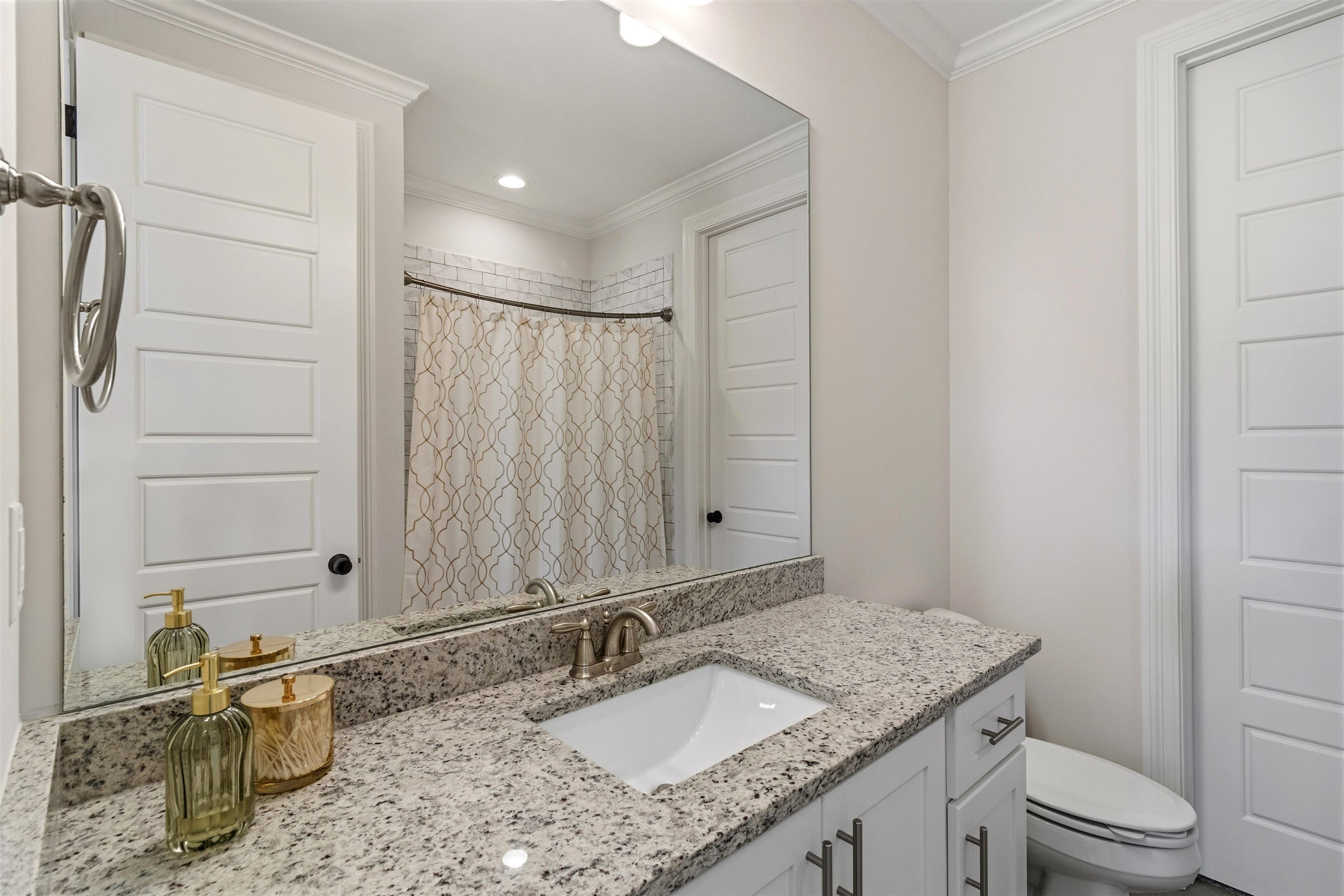 4757 Carousel Lane Collierville, TN 38017 - Photo 25 of 39 Full bathroom with curtained shower, vanity, and crown molding